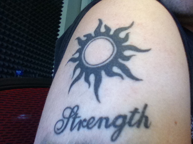Tribal Sun and Strength Tattoo On Shoulder