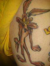 Wile E Coyote Tattoo On Bicep
