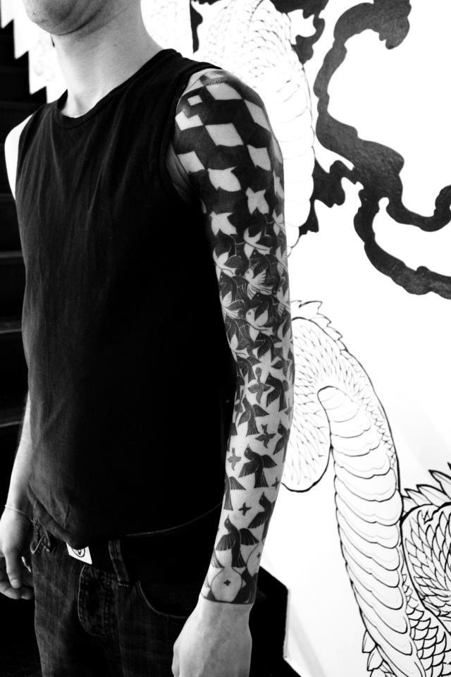 Nice Black Ink Escher Tattoo On Left Sleeve