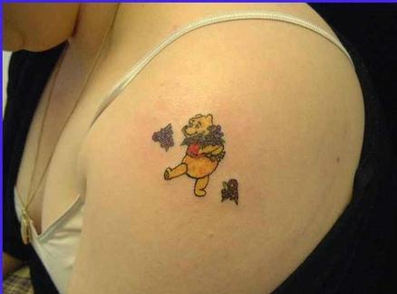 Winnie Pooh Cartoon Tattoo On Left Shoulder