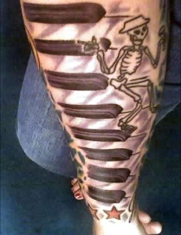 Nice Skeleton and Keyboard Tattoo On Sleeve