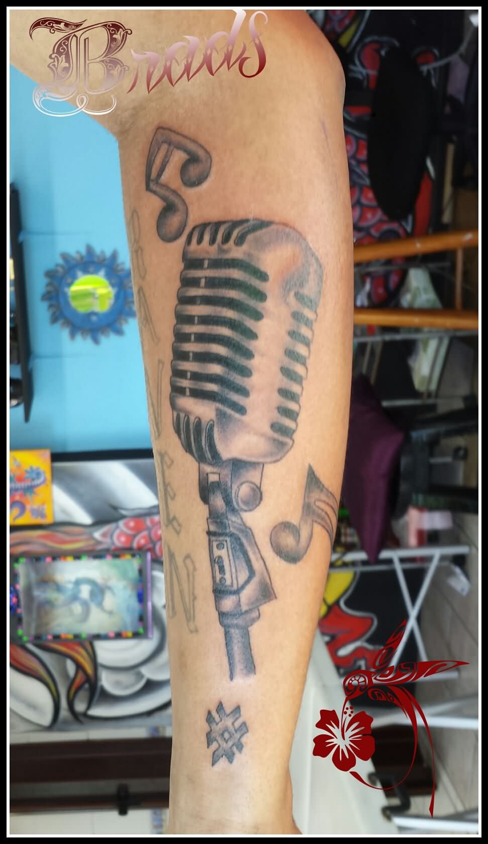 Grey Ink Old School Mic Tattoo On Sleeve
