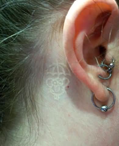 White Ink Tattoo Behind Ear
