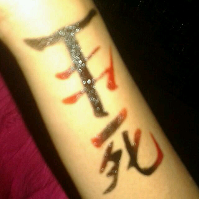 Red And Black Kanji Tattoo On Arm Sleeve