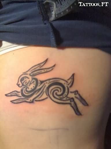 Tribal Running Rabbit Tattoo On Side Rib