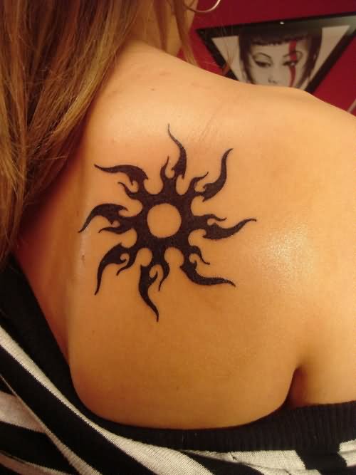 Tribal Sun Tattoo On Girl Back Shoulder
