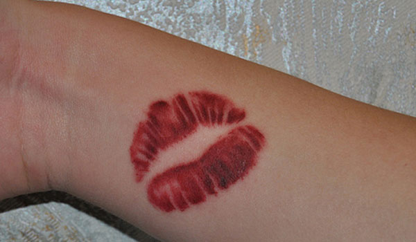 Small Red Lips Tattoo On Wrist