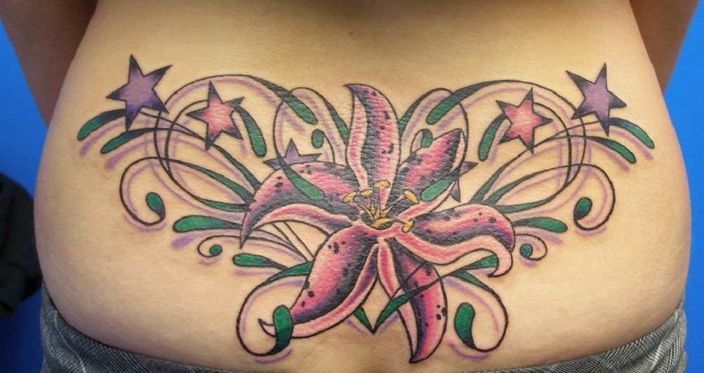 Stars And Flower Tattoo On Lower Back