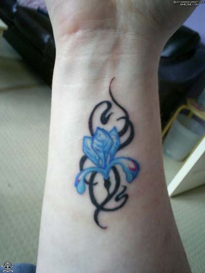 Tribal And Wrist Lily Tattoo