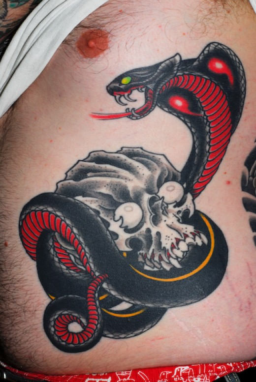 Black Cobra Snake With Skull Tattoo On Rib Cage