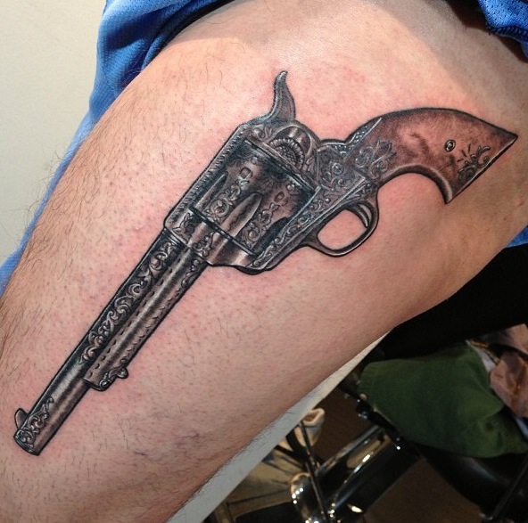Color Pistol Tattoo On Left Thigh
