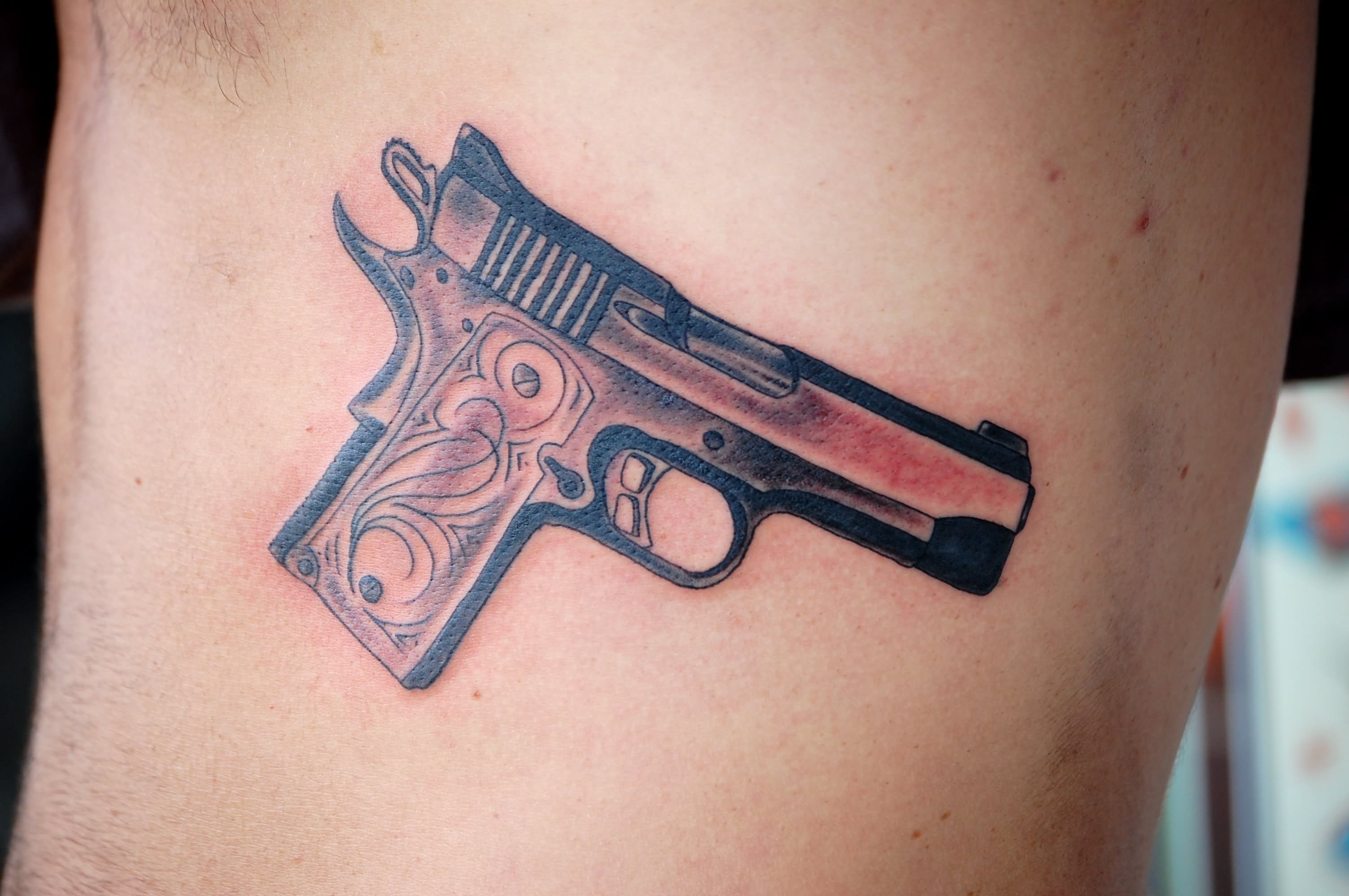 Cool Gun Tattoo On Rib Cage