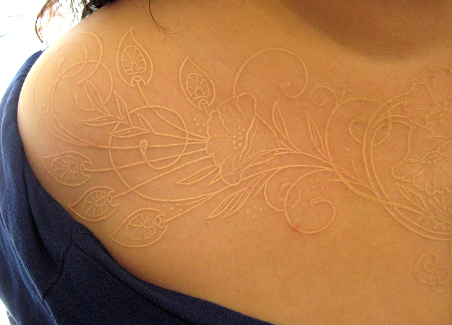 Flower White Ink Tattoo On Front For Girls