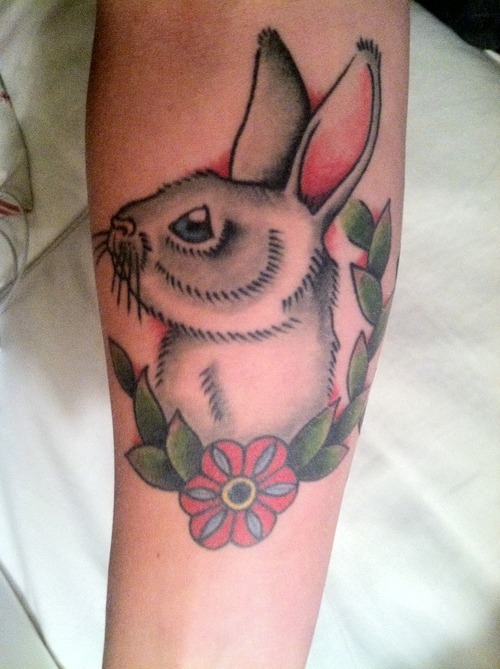 Grey And White Rabbit Tattoo On Arm