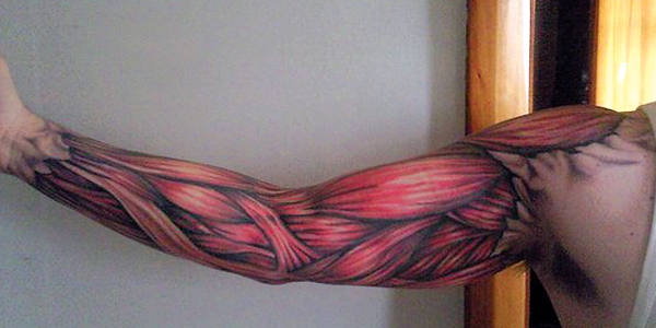 Red Muscles Tattoo On Man Right Sleeve