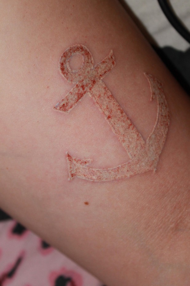 White Ink Anchor Tattoo On Arm