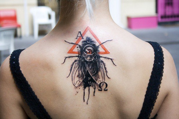 Cool Insect Tattoo On Upper Back For Girls