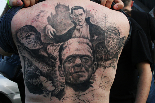 Grey Ink Horror Movie Tattoo On Back