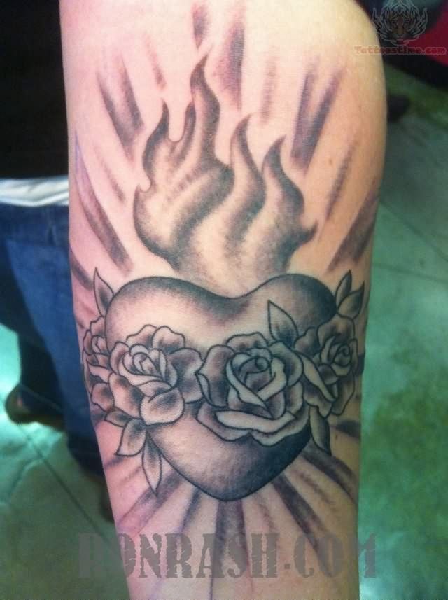 Grey Ink Sacred Heart Tattoo On Left Sleeve