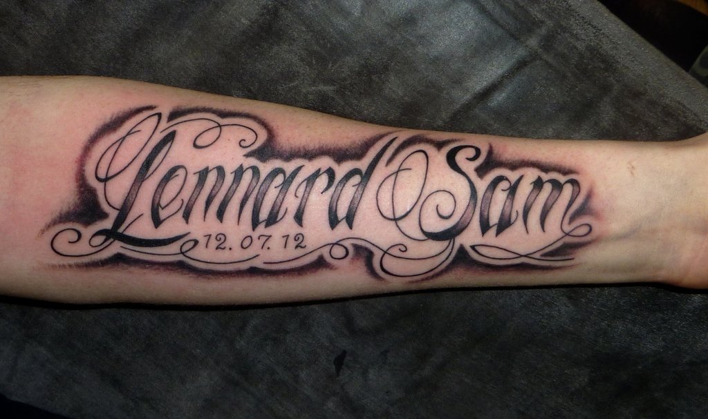 Lettering Tattoo On Left Forearm