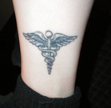 Medical Symbol Tattoo Design On Leg