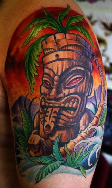 Tiki Tattoo On Left Half Sleeve By Cory Norris