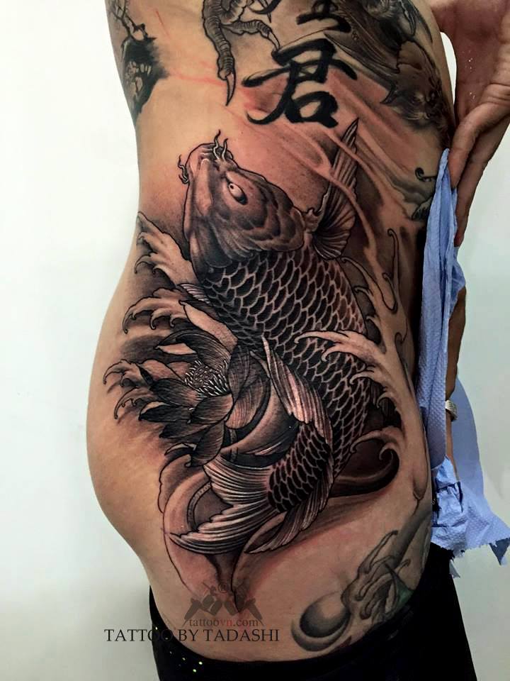 Grey Ink Koi Fish Tattoo On Rib Side by Tadashi