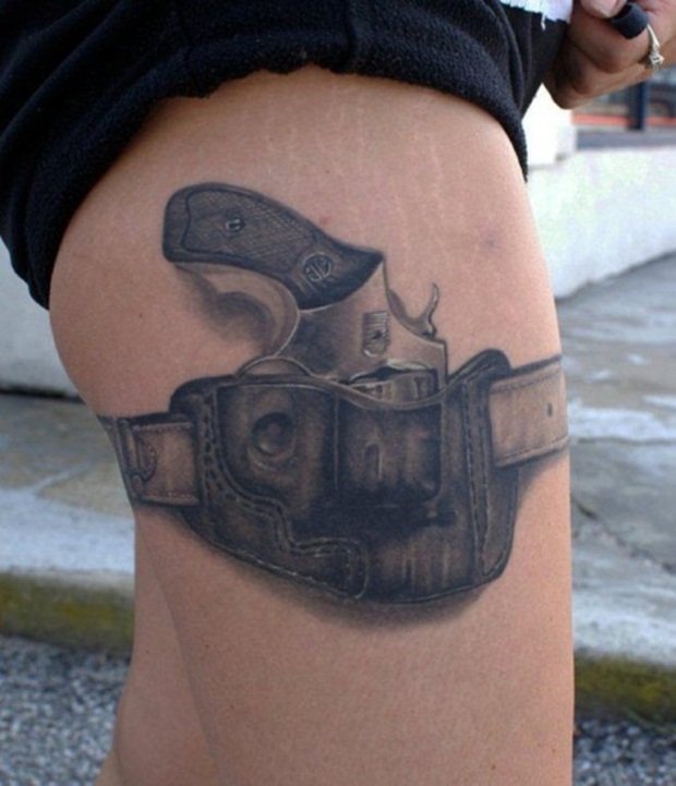 Beautiful Weapon Tattoo On Girl Thigh