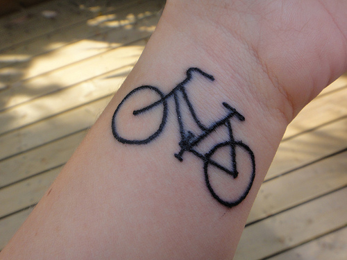 Black Outline Bike Tattoo On Wrist