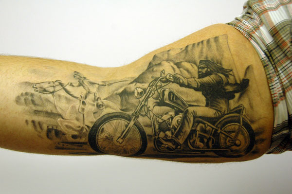 Grey Biker Tattoo On Man Right Sleeve