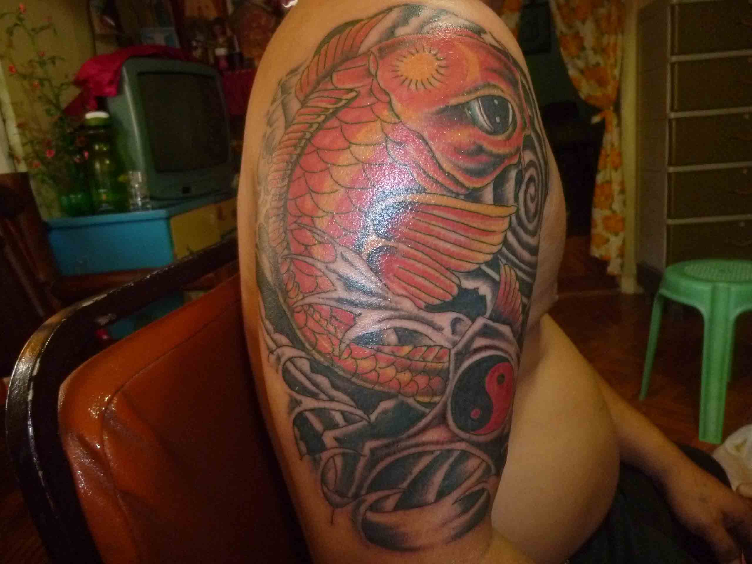 Japanese Koi Tattoo On Man Right Half Sleeve