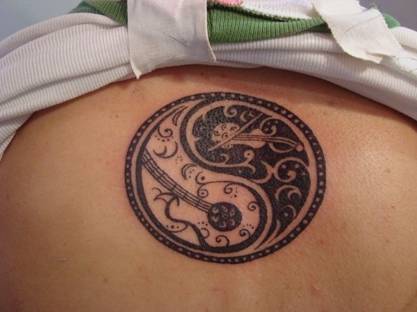 Music Guitars In Yin Yang Tattoo On Back