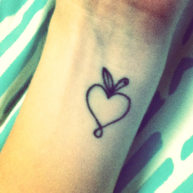 Outline Heart Apple Tattoo Design On Left Wrist