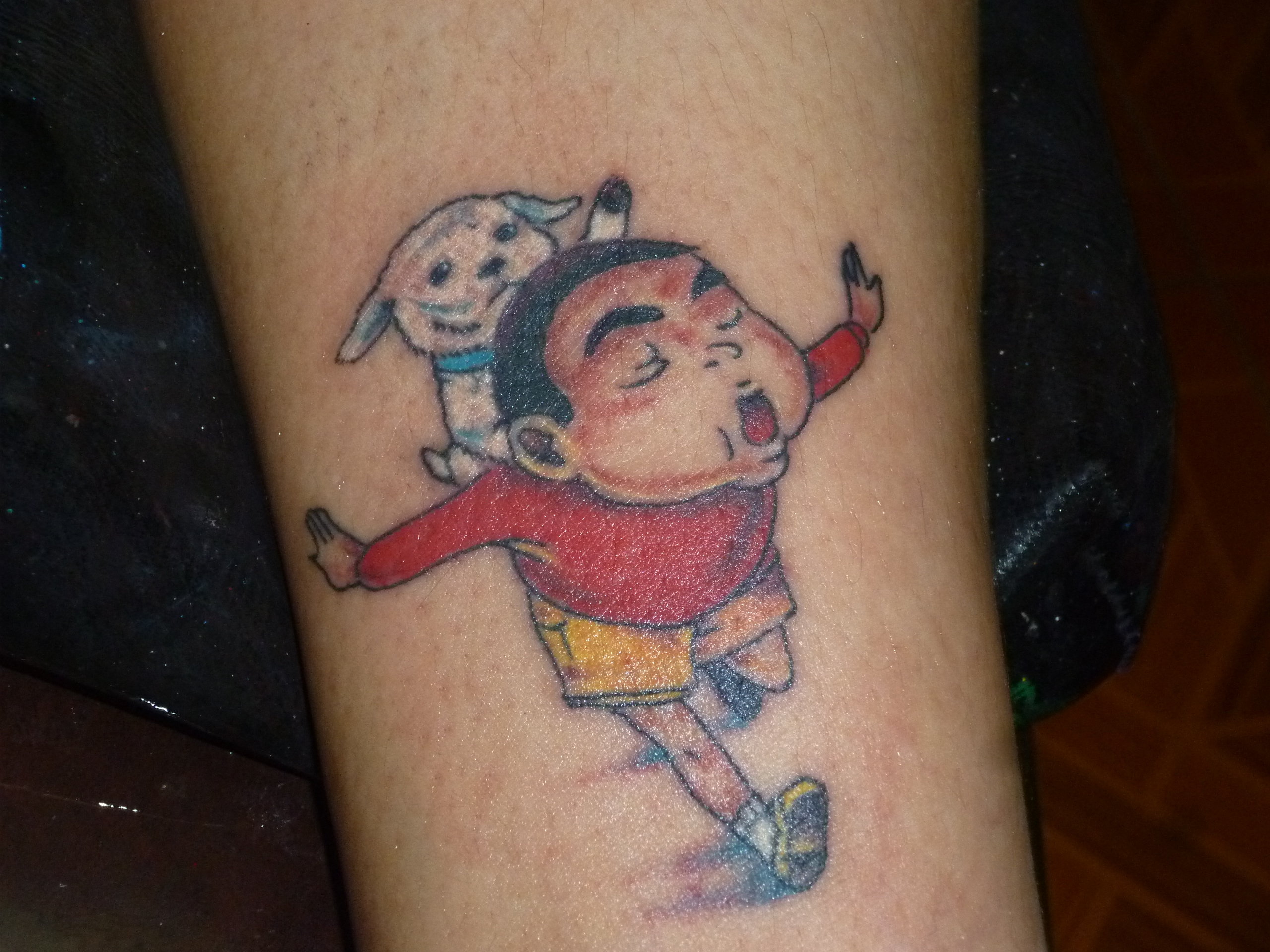 Crayon Shin Chan Tattoo On Arm