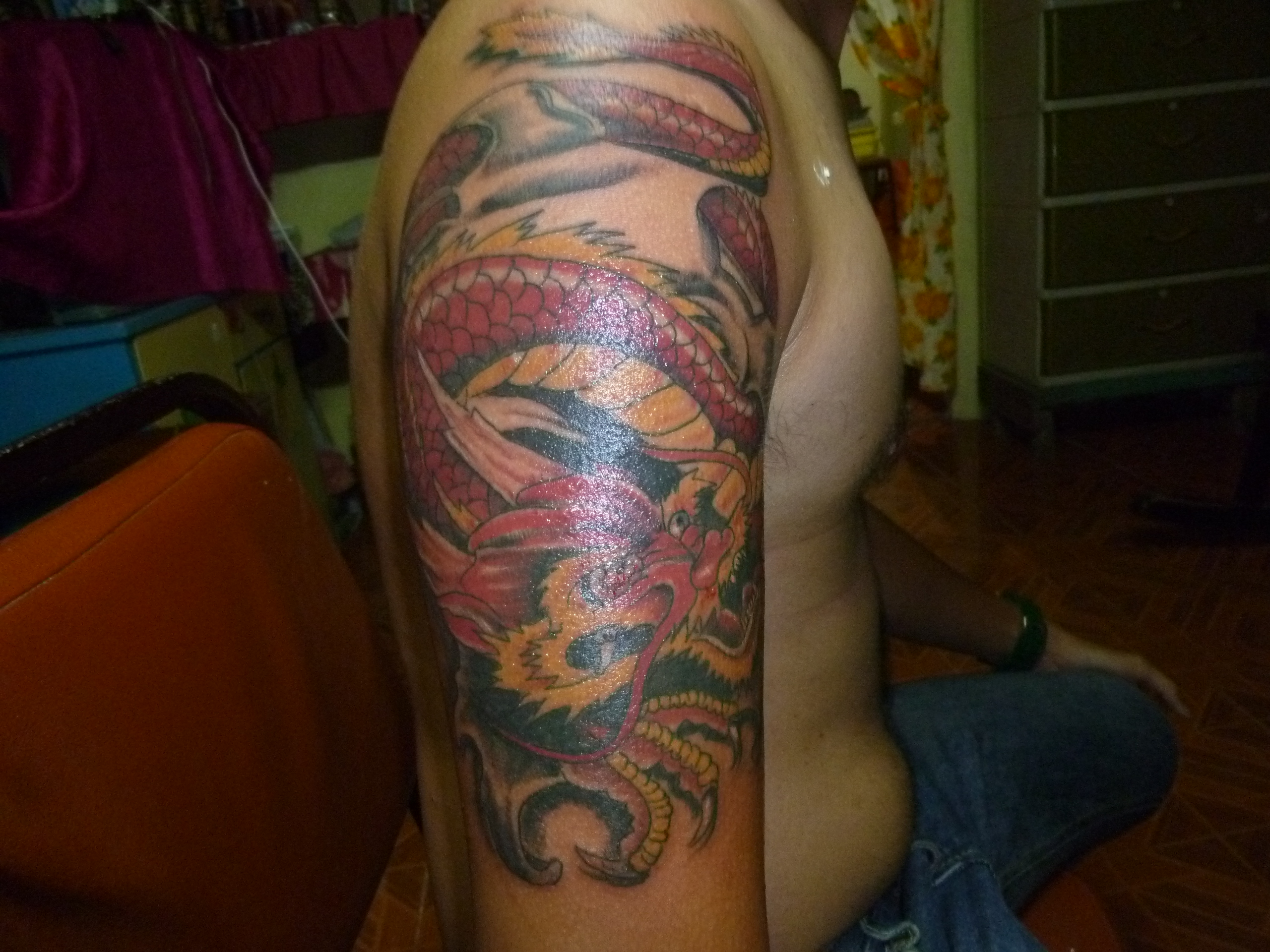 Red Dragon Tattoo On Right Half Sleeve