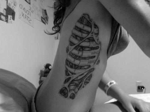 Ribcage Tattoo Design Idea For Girls