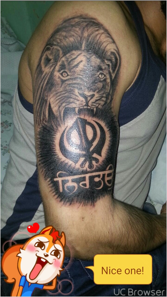 Black Ink Nirbhau And Khanda With Lion Head Tattoo On Half Sleeve