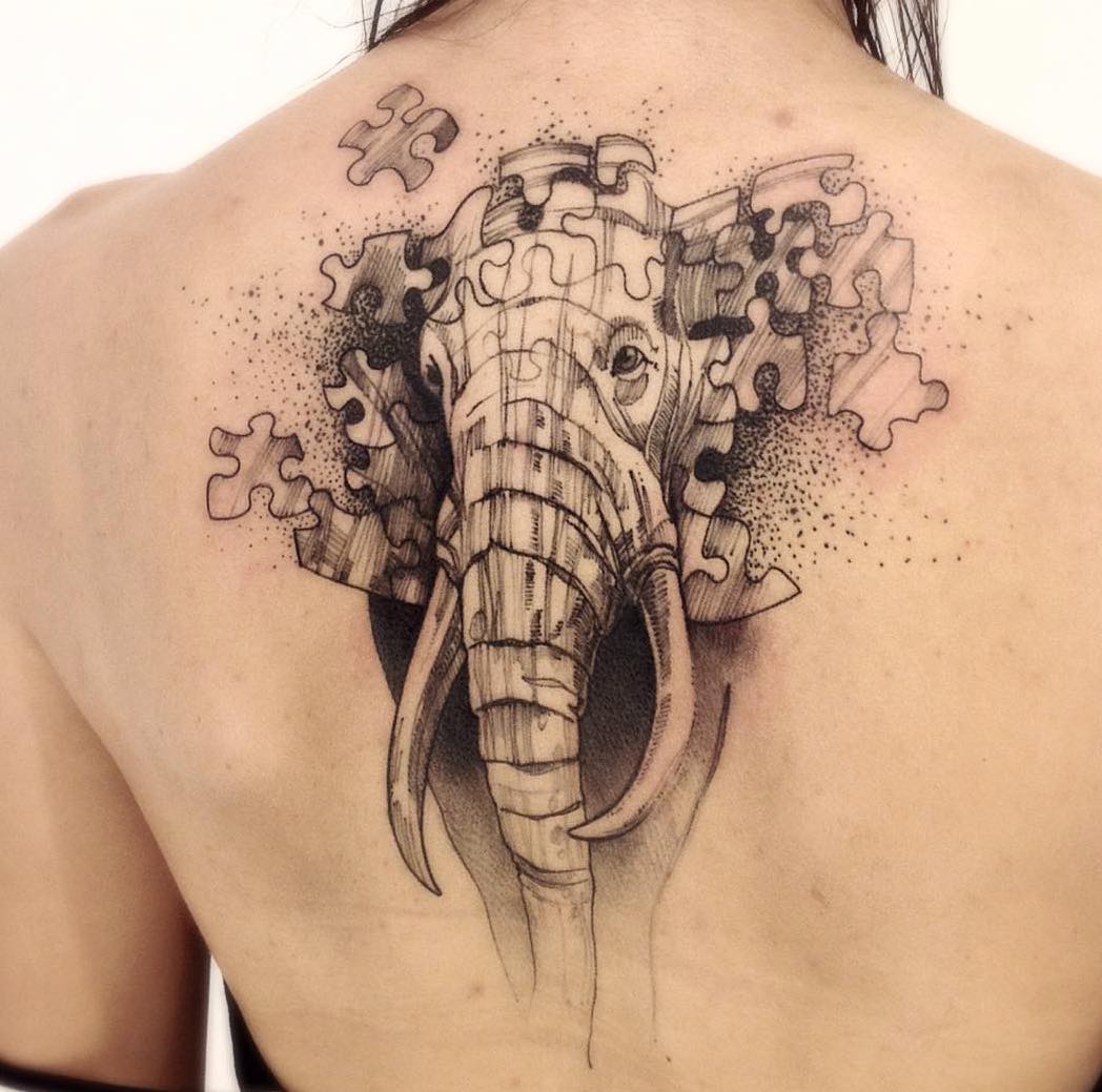Awesome Puzzle Elephant Tattoo On Upper Back