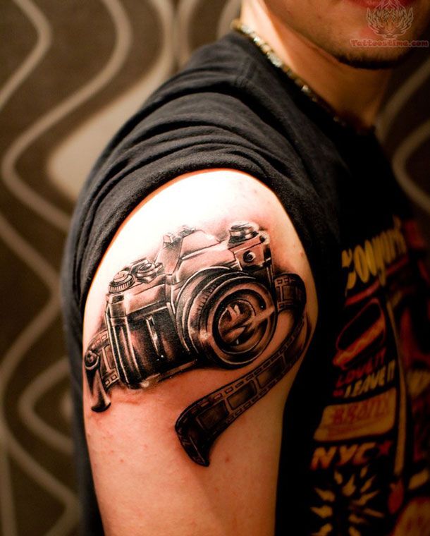 Black And Grey Camera Tattoo On Right Shoulder