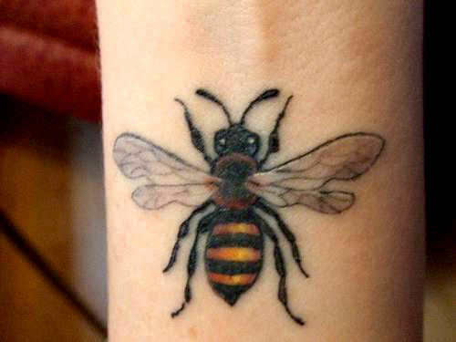 Colored Bumblebee Tattoo On Left Wrist