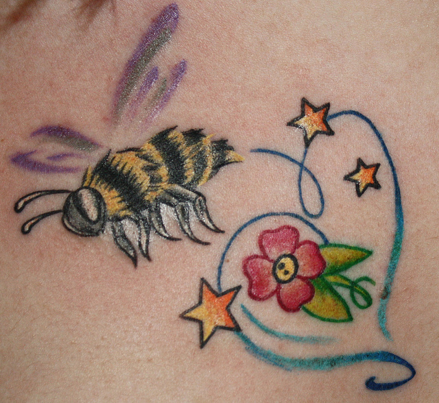 Cute Flower And Stars With Bumblebee Tattoo