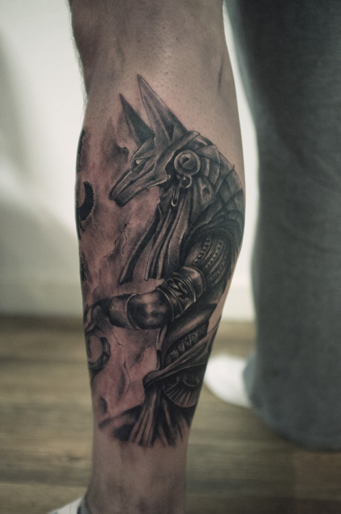 Grey Ink Anubis Tattoo On Left Leg by Torn Caine