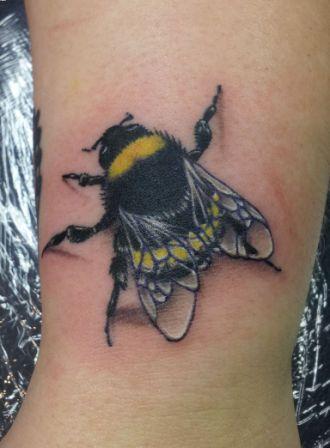 Realistic Bumblebee Tattoo On Left Bicep