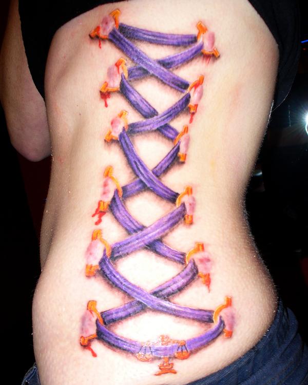 Purple Ribbon Corset Tattoo On Side Rib