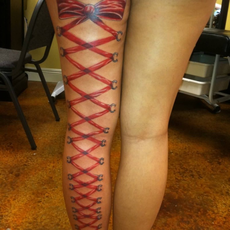Red Ribbon Corset Tattoo On Back Leg