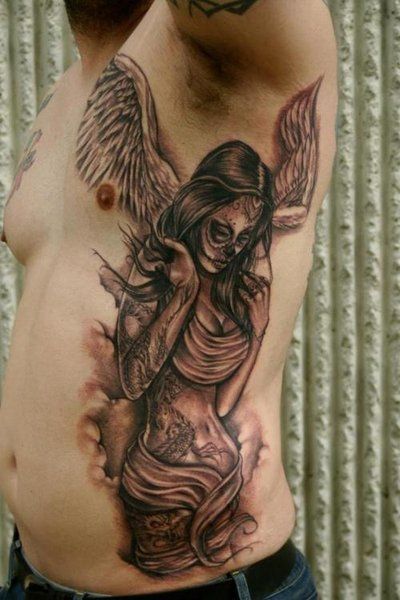 Man With Angel Tattoo On Side Rib