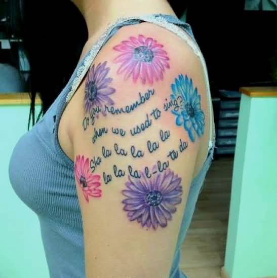 Beautiful Colored Daisy Tattoos On Left Shoulder For Girls