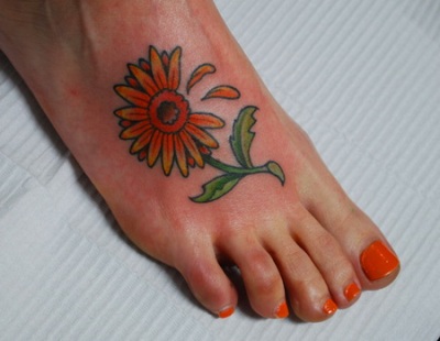 Daisy Tattoo On Girl Right Foot