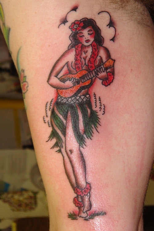 Pinup Girl With Small Guitar Tattoo On Bicep