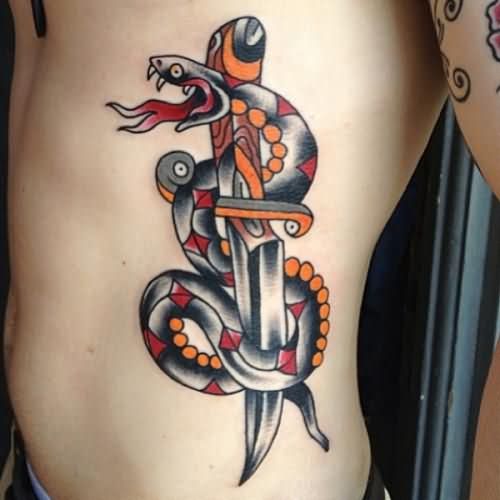 Snake And Dagger Tattoo On Man Side Rib
